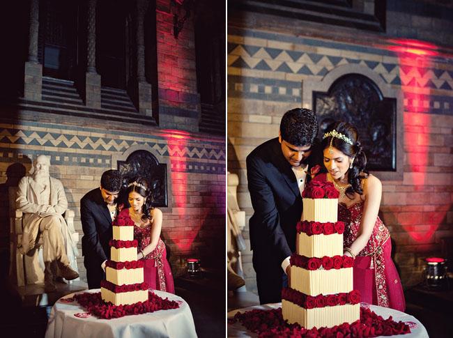 Bride and groom cutting the cake at their Natural History Museum Wedding Reception