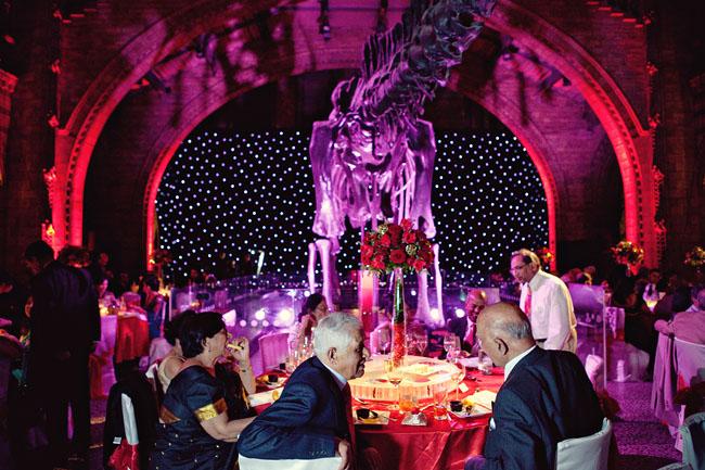 Dinosaur in the middle of the room at a Natural History Museum Wedding Reception