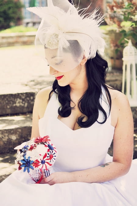 Vintage bride holding bouquet with vintage headdress - Vintage Wedding Shoot