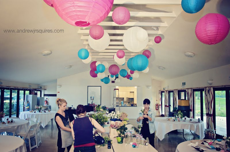 Setting up a wedding reception room by Andrew J R Squires Photography