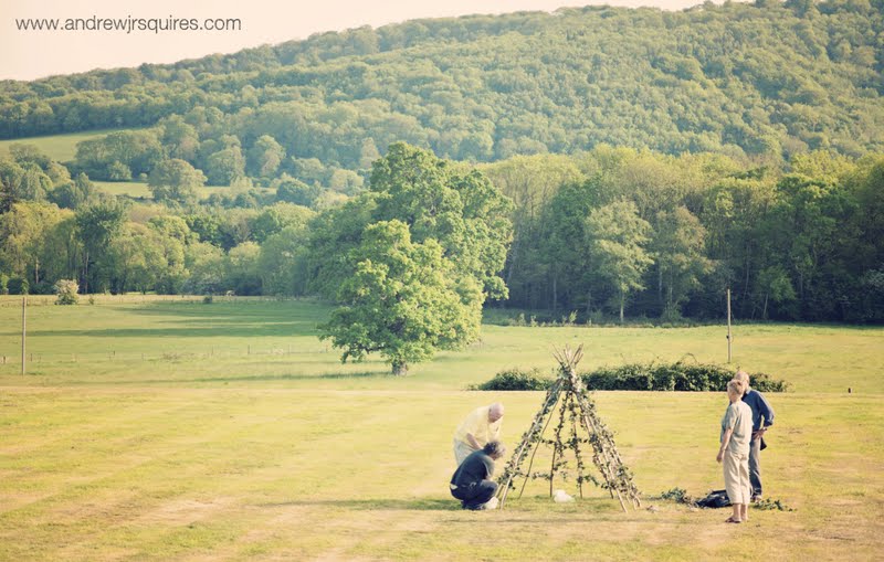 Field being prepared for a wedding reception by Andrew J R Squires Photography