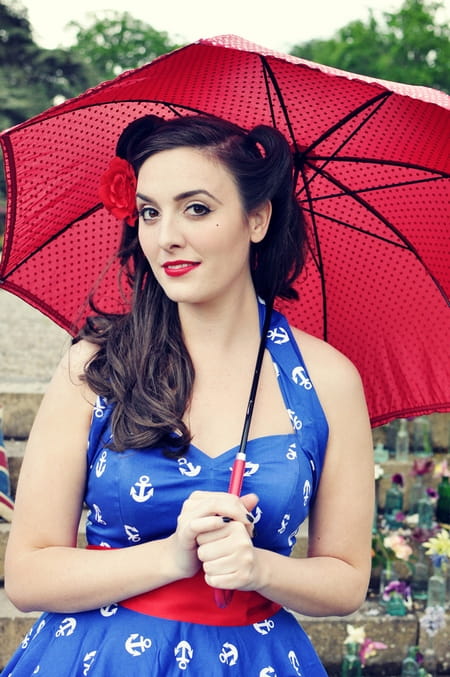 Vintage bride holding a red umbrella - Vintage Wedding Shoot