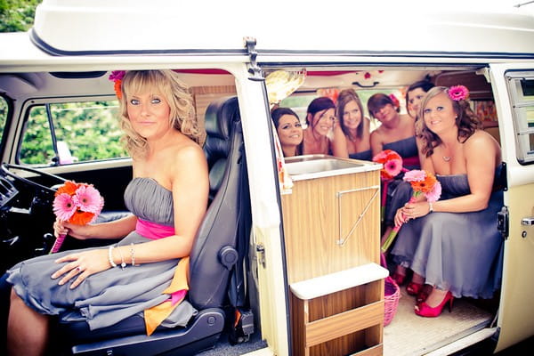 Bridesmaids sitting in a VW camper van - Martins Kikulis Photography