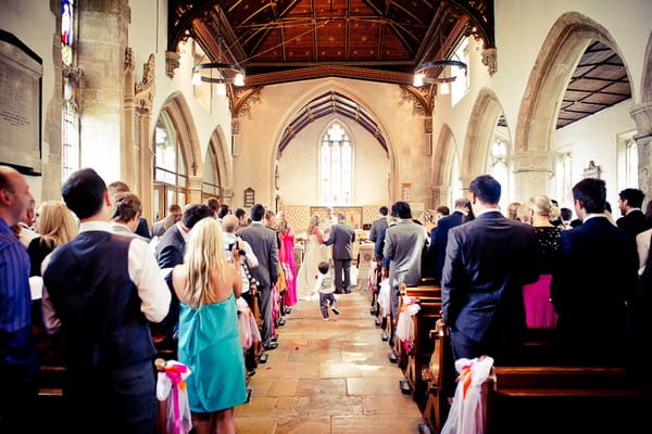 Bride and groom standing at the altar - Martins Kikulis Photography