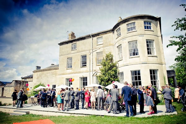 Guests outside a wedding venue - Martins Kikulis Photography