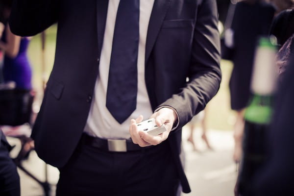 Magician holding cards - Martins Kikulis Photography