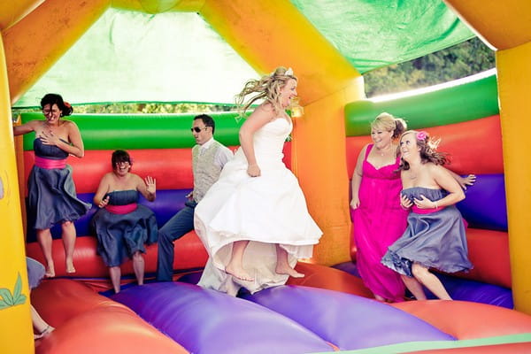 Bride on a bouncy castle - Martins Kikulis Photography