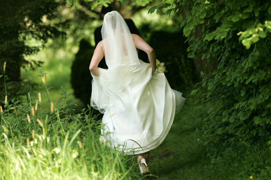 Bride running by Martin Beddall Photography