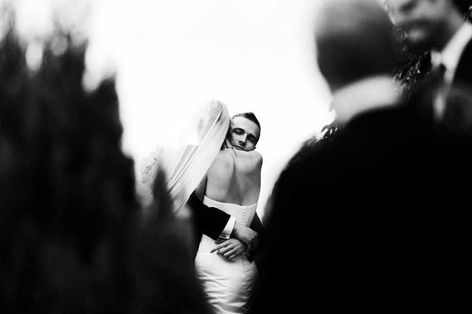 Bride and groom hugging by Martin Beddall Photography