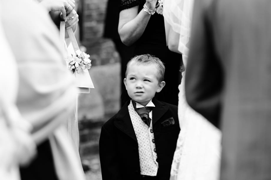 Page boy pulling a funny expression by Martin Beddall Photography