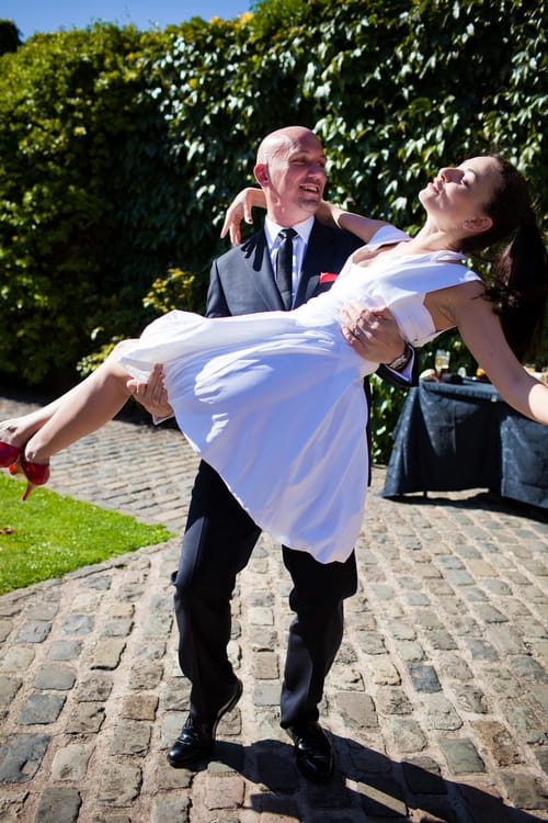 Groom carrying his bride - Sam Gibson Wedding Photography