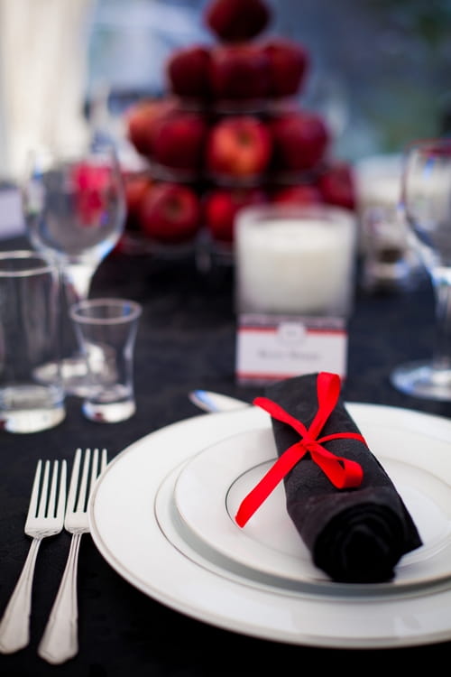 Black napkin with red bow - Sam Gibson Wedding Photography