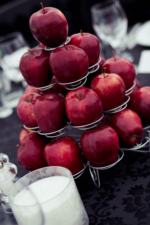 Red apple wedding table display - Sam Gibson Wedding Photography