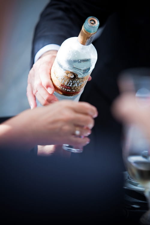 Pouring Russian vodka - Sam Gibson Wedding Photography