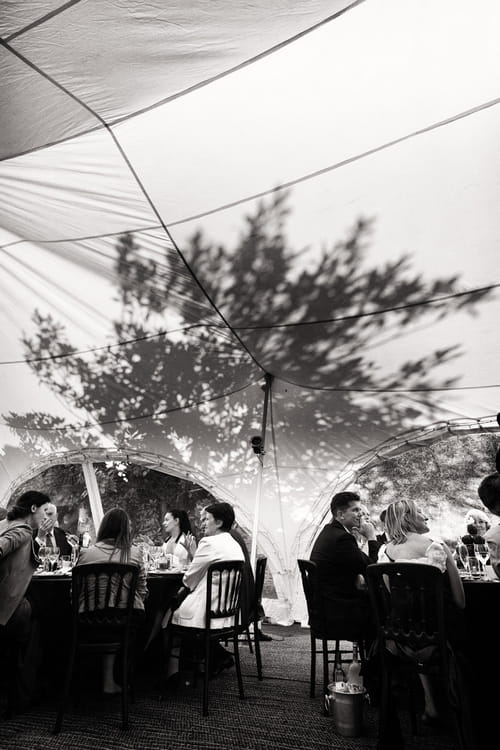 Silhouette of a tree on a marquee - Sam Gibson Wedding Photography