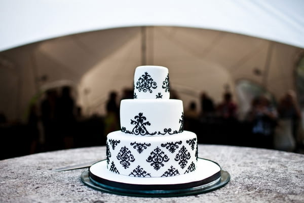 White and black 3 tier wedding cake - Sam Gibson Wedding Photography