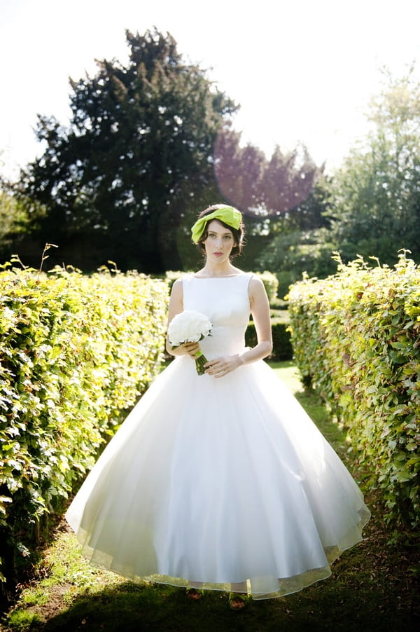 Bride in Loulou dress holding white bouquet - Good Day Sunshine Bridal Shoot