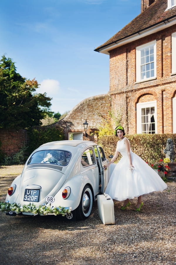 Bride opening the door of white VW Beetle - Good Day Sunshine Bridal Shoot