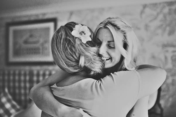 Bride hugging friend