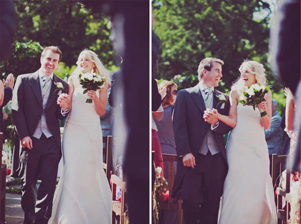 Newly married bride and groom walking back down the aisle