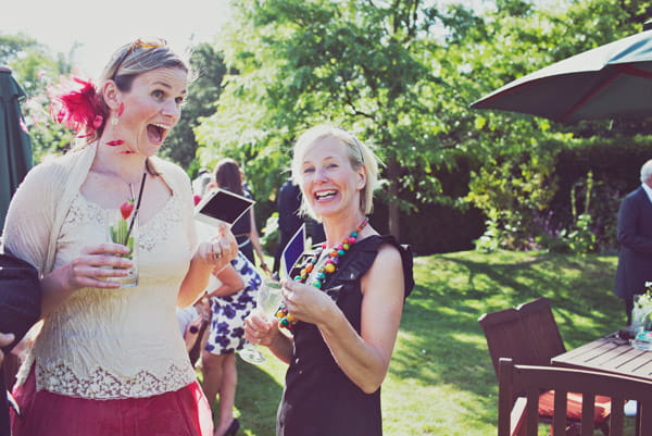 Wedding guests with polaroid pictures