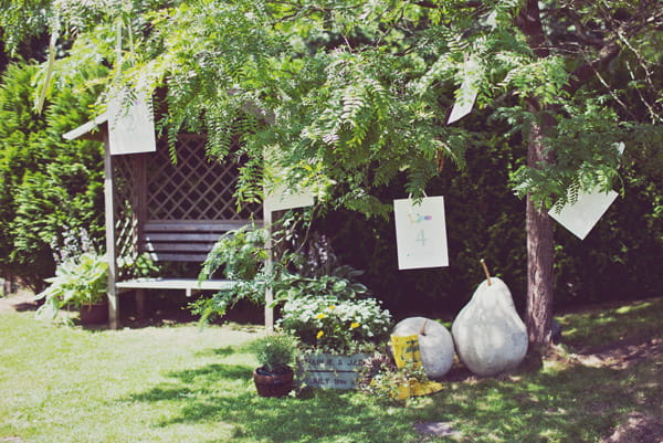 Wedding table plan hanging from a tree