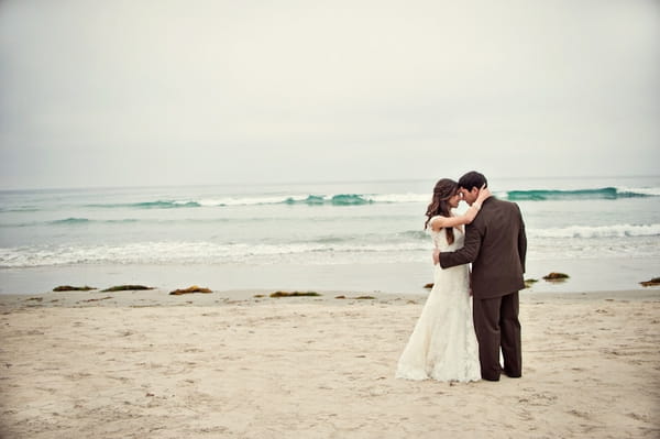 Bride and groom on beach - Picture by Captured by Aimee