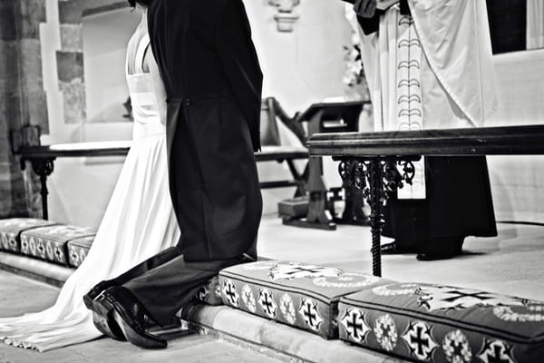 Bride and groom kneeling - Picture by Andrew J R Squires Photography