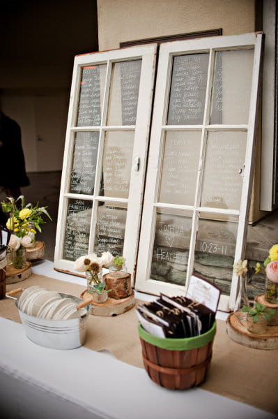 Wedding table plan written on windows - Picture by Captured by Aimee