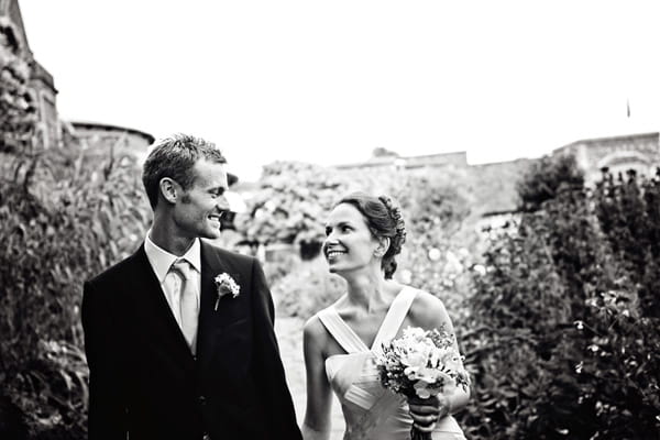 Bride and groom smiling at each other - Picture by Andrew J R Squires Photography