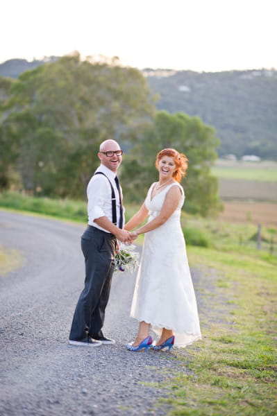 Bride and groom holding hands - Picture by Andrea Sproxton Photography