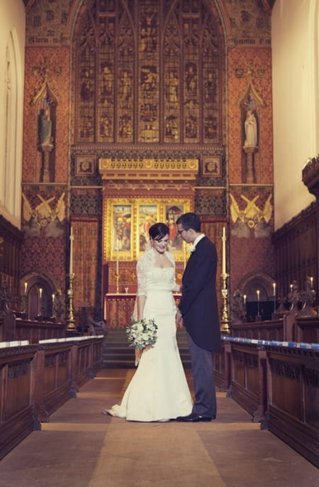 Bride and groom in Queen's College Chapel - Picture by Laura McCluskey Photography