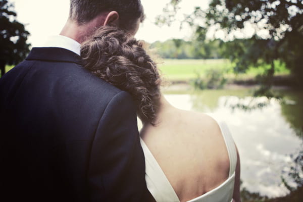 Bride resting head on groom's shoulder - Picture by Andrew J R Squires Photography