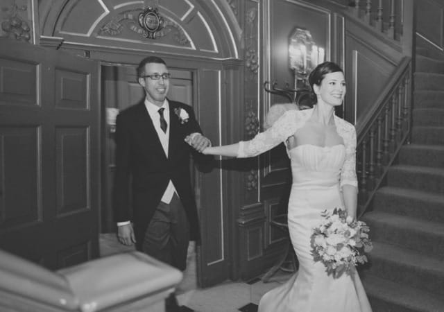 Bride and groom holding hands - Picture by Laura McCluskey Photography