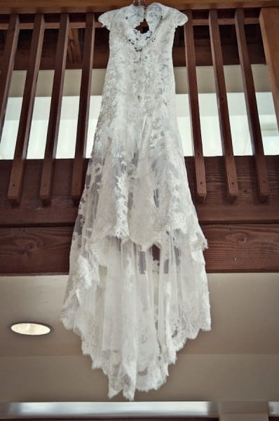 Wedding dress hanging from rail - Picture by Captured by Aimee