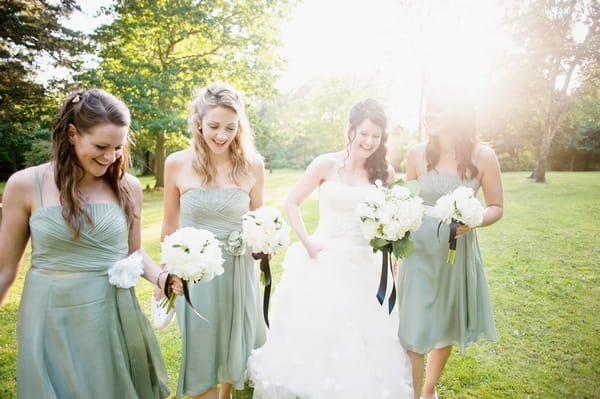 Bride and bridesmaids with white bouquets - Picture by Lemontree Photography