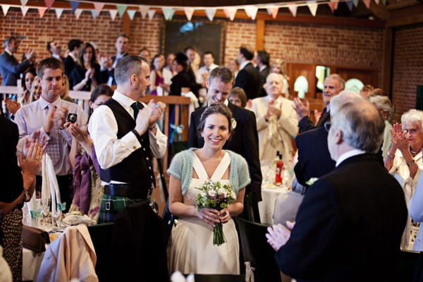 Bride and groom entering wedding reception - Picture by Andrew J R Squires Photography