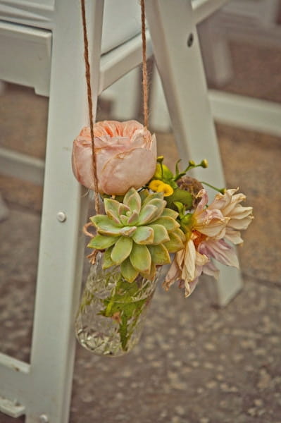 Flowers in vase hanging from chair - Picture by Captured by Aimee