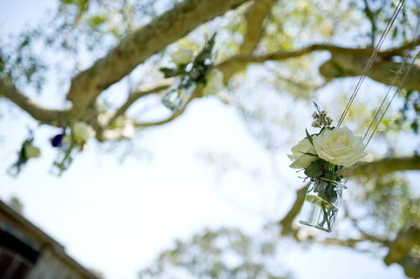 Rose in jam jar hanging in tree - Picture by Andrea Sproxton Photography