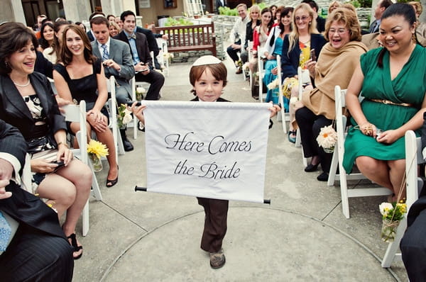 Boy holding Here Comes the Bride sign - Picture by Captured by Aimee