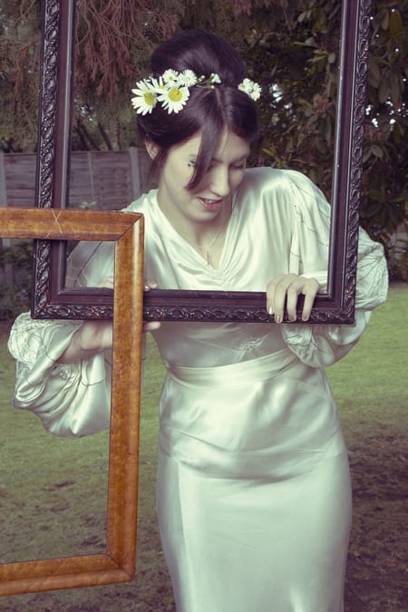 Bride posing with picture frames - Picture by Ian Shoots Weddings