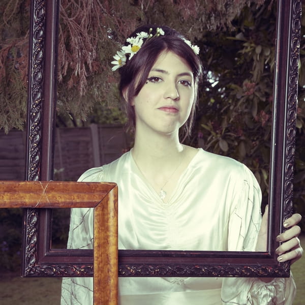 Bride holding picture frame - Picture by Ian Shoots Weddings