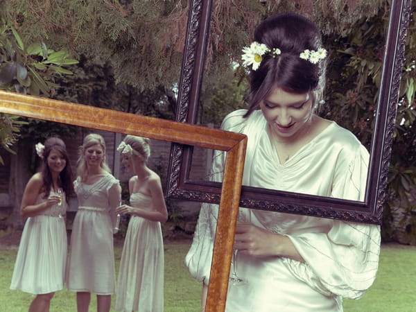 Bride and bridesmaids posing with picture frames - Picture by Ian Shoots Weddings