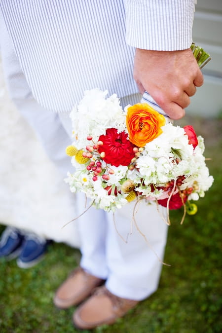 Groom holding bouquet - Picture by Laura Ivanova Photography