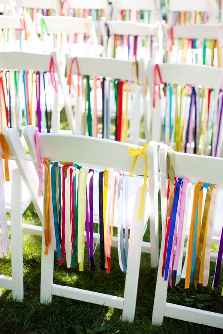 Coloured ribbon hanging on chairs - Picture by Laura Ivanova Photography