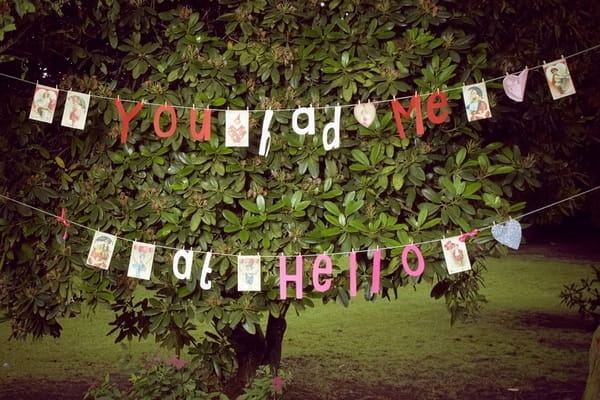 Hanging letters spelling 'You Had Me At Hello' - Picture by Ian Shoots Weddings