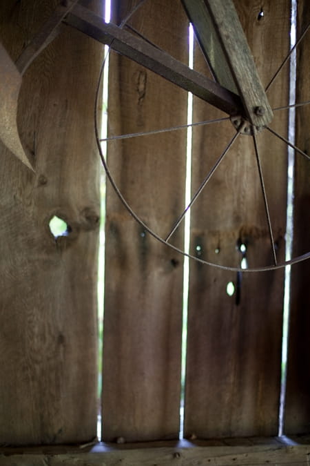 Wheel hanging in barn - Picture by Levi Stolove Photography
