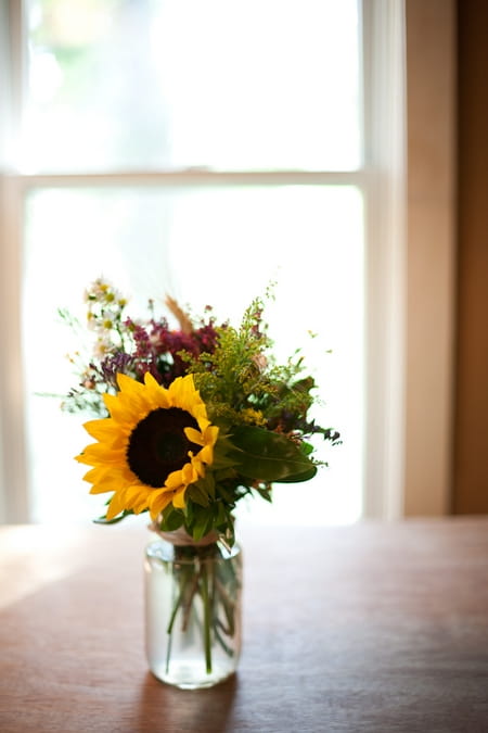 Jar of flowers with sunflower - Picture by Levi Stolove Photography