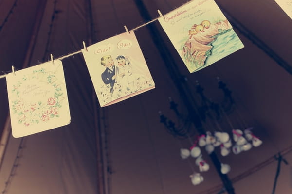 Vintage cards hanging from clothes line - Picture by Ian Shoots Weddings