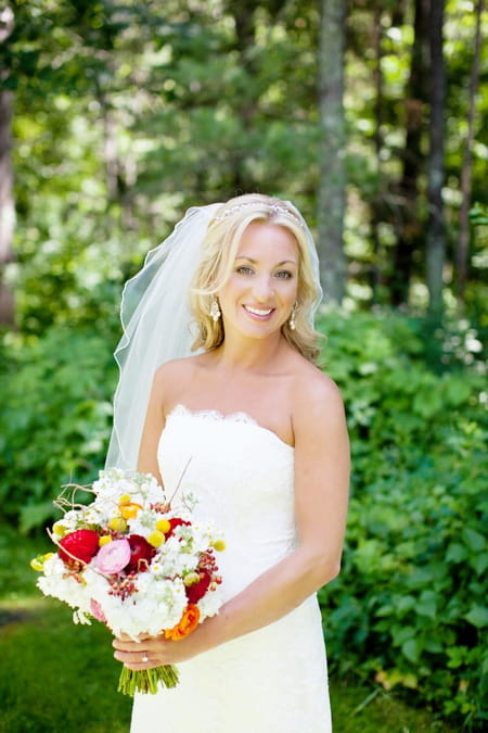 Bride holding colourful bouquet - Picture by Laura Ivanova Photography